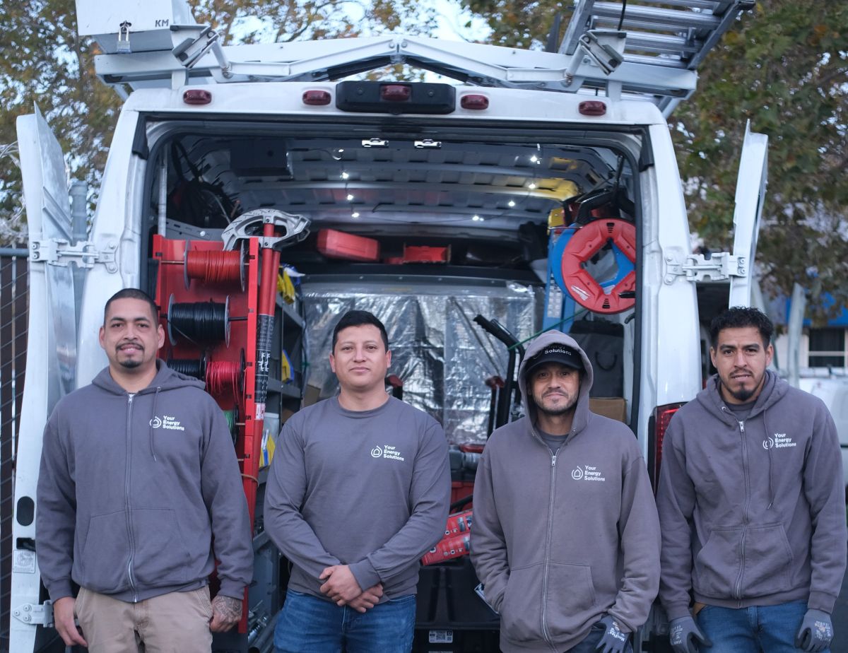 YES team in front of work truck